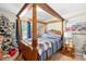 Comfortable primary bedroom features a four poster bed and stylish decor at 2490 Hawk Ridge Dr, Gastonia, NC 28056