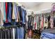 Walk-in closet with extensive shelving and hanging space for organized storage at 2490 Hawk Ridge Dr, Gastonia, NC 28056