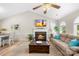 Inviting living room with fireplace, comfortable seating, and seamless flow to the kitchen and dining area at 2490 Hawk Ridge Dr, Gastonia, NC 28056