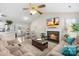 Cozy living room featuring a fireplace, hardwood floors, and a dining area, perfect for Gathering gatherings at 2490 Hawk Ridge Dr, Gastonia, NC 28056