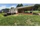 View of the back of home with deck and covered area at 2547 Nc 182 Hwy, Lincolnton, NC 28092