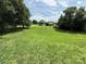 Large backyard with a well-manicured lawn and mature trees at 2547 Nc 182 Hwy, Lincolnton, NC 28092