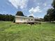 Well-maintained backyard featuring a deck and lush green lawn at 2547 Nc 182 Hwy, Lincolnton, NC 28092