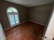 Bedroom featuring hardwood floors, neutral walls, and a large window at 2547 Nc 182 Hwy, Lincolnton, NC 28092