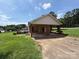 Large carport with brick pillars, providing covered parking at 2547 Nc 182 Hwy, Lincolnton, NC 28092