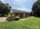 Charming single story brick house with well-manicured lawn and attached covered carport at 2547 Nc 182 Hwy, Lincolnton, NC 28092