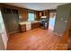 Functional kitchen with stainless steel appliances, adjacent to living area and hardwood floors at 2547 Nc 182 Hwy, Lincolnton, NC 28092