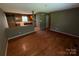 Open concept living room with hardwood floors offering seamless transition to the adjacent kitchen at 2547 Nc 182 Hwy, Lincolnton, NC 28092