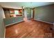 Open concept living room with hardwood floors offering seamless transition to the adjacent kitchen at 2547 Nc 182 Hwy, Lincolnton, NC 28092