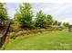 Grassy backyard with trees at 2720 Watergarden St, York, SC 29745