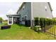Well-maintained backyard with greenery and a screened porch at 2720 Watergarden St, York, SC 29745