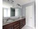 Bathroom with double sink vanity, granite countertops, and wood cabinets offers luxury and convenience at 2720 Watergarden St, York, SC 29745