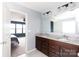 Bathroom features a double sink vanity with granite countertops and wood cabinets at 2720 Watergarden St, York, SC 29745
