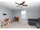 Bonus room offers a comfortable space with natural light, shelving, and a sleeper sofa at 2720 Watergarden St, York, SC 29745