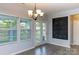 Bright dining area featuring gray walls, modern chandelier, and access to the outdoor space at 2720 Watergarden St, York, SC 29745