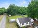 Aerial view of a home with a backyard, privacy fence, green spaces, and above-ground pool at 301 Rowan Gq St, Salisbury, NC 28146