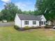 Well maintained, fenced backyard showing a detached garage and fresh landscaping at 301 Rowan Gq St, Salisbury, NC 28146