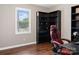 Bright bedroom featuring wood floors, desk, modern shelving and a large window for natural light at 301 Rowan Gq St, Salisbury, NC 28146