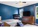 Cozy bedroom features hardwood floors, ceiling fan, and natural light from two windows at 301 Rowan Gq St, Salisbury, NC 28146
