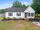 Charming single-story home with a well-manicured lawn and fresh landscaping, offering great curb appeal at 301 Rowan Gq St, Salisbury, NC 28146