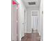 Hallway with wood floors leads to bathroom and bedroom with natural light at 301 Rowan Gq St, Salisbury, NC 28146