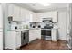 Clean and spacious kitchen with white cabinetry, granite countertops, and modern appliances at 301 Rowan Gq St, Salisbury, NC 28146