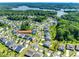 Beautiful aerial view of a lakeside community surrounded by mature trees and well maintained lawns at 3041 Winged Teal Ct, Belmont, NC 28012