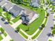 A high-angle view of a residence with manicured lawns, mature trees, and a well-maintained neighborhood at 3041 Winged Teal Ct, Belmont, NC 28012