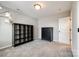 Bedroom with light gray walls, carpet floors, and a dark wood dresser and bookcase at 3041 Winged Teal Ct, Belmont, NC 28012