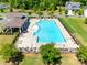 Aerial view of the community pool featuring ample seating and a shaded area at 3041 Winged Teal Ct, Belmont, NC 28012