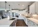 White kitchen featuring stainless steel appliances, stylish countertops, and custom cabinetry at 3041 Winged Teal Ct, Belmont, NC 28012