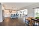 Open-concept kitchen boasts an island with seating and stainless steel appliances at 3041 Winged Teal Ct, Belmont, NC 28012