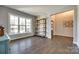 Bright living room featuring hardwood floors, a large window, and easy access to the foyer at 3041 Winged Teal Ct, Belmont, NC 28012