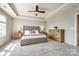 Serene main bedroom with tray ceilings, soft lighting, and a neutral color palette at 3041 Winged Teal Ct, Belmont, NC 28012
