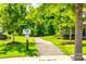 Nature trail entrance with sign and lush green landscaping at 3041 Winged Teal Ct, Belmont, NC 28012