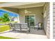 Covered patio with outdoor seating, a ceiling fan, and sliding glass doors leading inside at 3041 Winged Teal Ct, Belmont, NC 28012