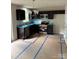 A modern kitchen with stainless steel appliances, dark cabinets, and granite countertops at 319 Conner St, Lancaster, SC 29720