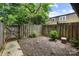 Private backyard featuring a wooden fence, mature trees, and minimal landscaping at 3500 Colony Rd # B, Charlotte, NC 28211