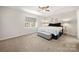 Comfortable bedroom featuring neutral colors, soft carpet, and a ceiling fan with light at 3500 Colony Rd # B, Charlotte, NC 28211