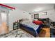 Bedroom featuring hardwood floors, a cozy rug, a TV, and a comfortable bed at 3500 Colony Rd # B, Charlotte, NC 28211