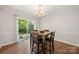 Dining area with wood floors and sliding glass doors that open to an outdoor deck at 3500 Colony Rd # B, Charlotte, NC 28211