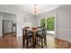 Dining area with wood table and four chairs with door to outdoor deck at 3500 Colony Rd # B, Charlotte, NC 28211
