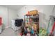 Clean laundry room with tile flooring, a washer and dryer, and storage shelves for cleaning supplies at 3500 Colony Rd # B, Charlotte, NC 28211