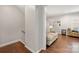 Open-concept living room entrance with hardwood floors, neutral paint and access to the stairs at 3500 Colony Rd # B, Charlotte, NC 28211