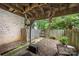 Back patio featuring brick and wood structural elements, and leading to a fenced yard at 3500 Colony Rd # B, Charlotte, NC 28211