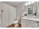 This bathroom features floral wallpaper, a white vanity, and a shower with white accents at 353 Tall Oaks Trl, Fort Mill, SC 29715