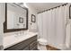 Bathroom featuring a large mirror, modern vanity, and a shower with white curtain and fixtures at 353 Tall Oaks Trl, Fort Mill, SC 29715