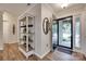 Entryway features wood-look floors, shelving, and a decorative mirror, creating a warm welcome at 353 Tall Oaks Trl, Fort Mill, SC 29715
