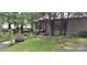 Charming home exterior displaying lush landscaping, mature trees, and a welcoming front yard at 353 Tall Oaks Trl, Fort Mill, SC 29715