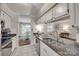 Kitchen features granite counters, stainless steel appliances, double sinks and bright, airy space at 353 Tall Oaks Trl, Fort Mill, SC 29715